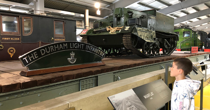 little boy looking at display inside Locomotion museum